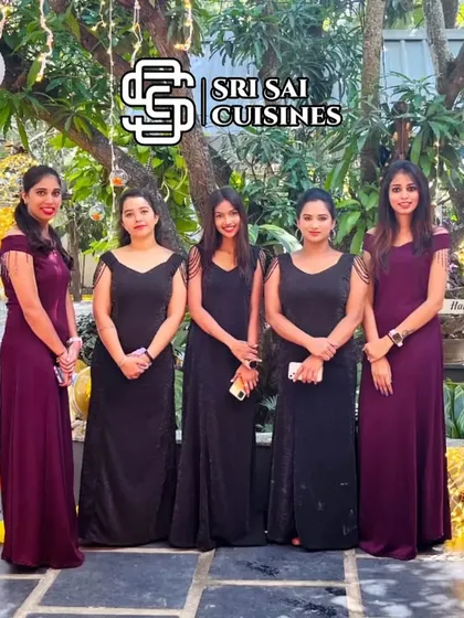 For formal evening events, galas, or receptions, we offer sophisticated attire options like these elegant full-length gowns. Our hostesses are pictured here in matching black and deep purple gowns, ready to provide impeccable service that matches the formality of your special occasion.