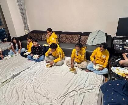 A fun evening hosted by friends of the academy. Our team enjoying a meal together, sitting on the floor in a true family style.