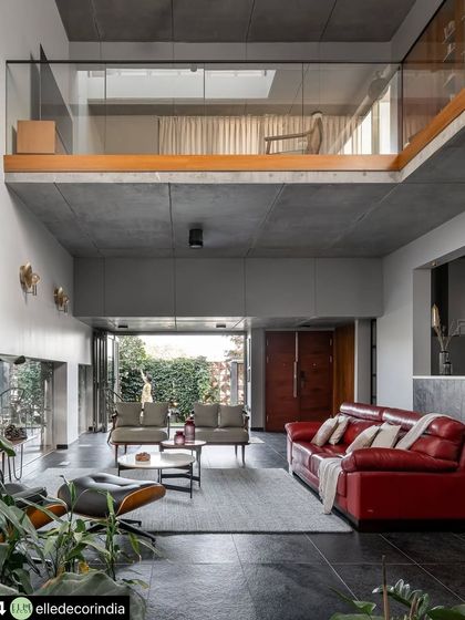 The mezzanine level overlooks the main living area, creating a visual connection between the private family space above and the social hub below. This open, layered design makes the home feel connected and spacious.