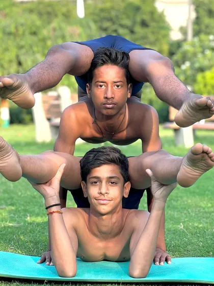 Building strength and trust together. This partner acro-yoga pose showcases the incredible balance and coordination our young yogis develop through dedicated practice and teamwork.