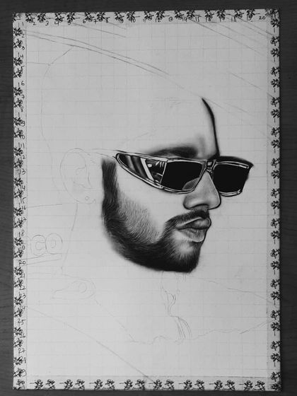 A step-by-step look at my 85-hour portrait of Baseer Ali. You can see the grid lines and how I build up the layers of graphite and charcoal to create a photorealistic effect.