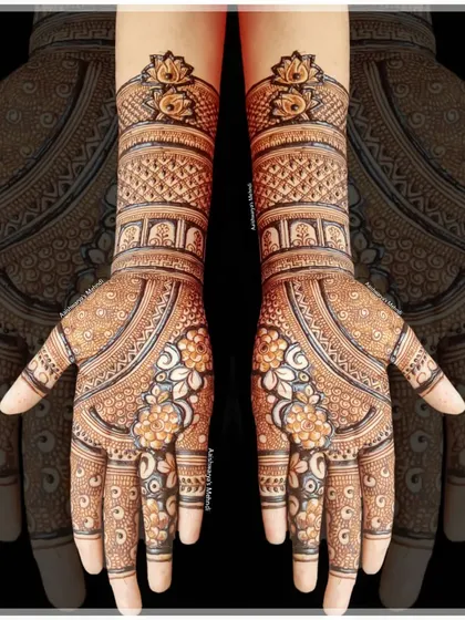 An elegant bridal design with delicate floral patterns on the palms and peacock motifs on the wrists. The fine line work is perfect for a sophisticated look.
