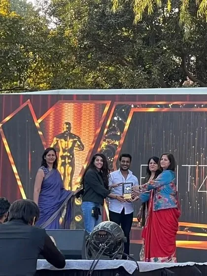 Another view of me accepting an award on stage. This recognition fuels my commitment to providing the best dance education and choreography.