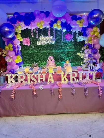 A perfectly pink Peppa Pig party for Krisha and Kriti. I use custom backdrops, themed table settings, and light-up letters to make every detail match your child's favorite characters.