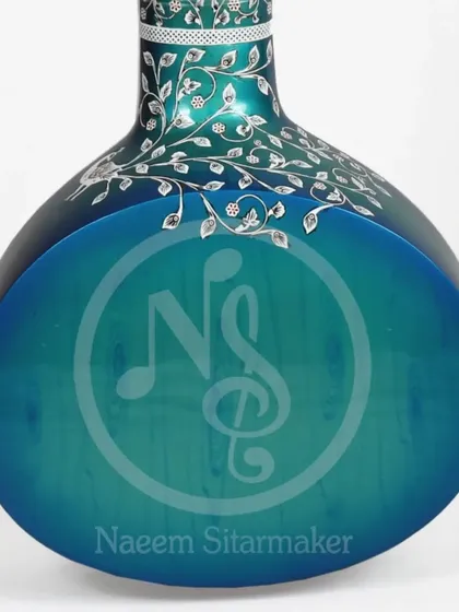 A view of the back of the blue rock sitar, showing the smooth finish and the delicate vine pattern on the neck. Our logo is subtly placed to show its authenticity.
