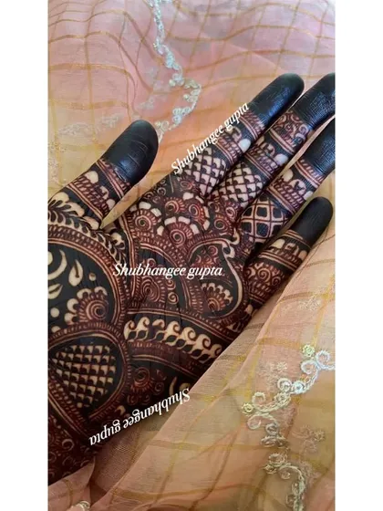The final stain is the most important part. I use my own all natural henna paste, which develops into this deep, rich reddish brown color. Achieving a dark and long lasting henna stain is a skill I teach in all my classes.