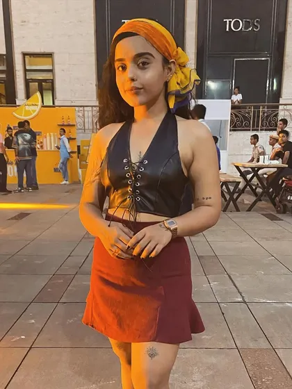 A full-body shot of my cowgirl outfit for Sunset Fest. I believe in sustainable fashion, mixing and matching pieces to create unique looks for every gig.