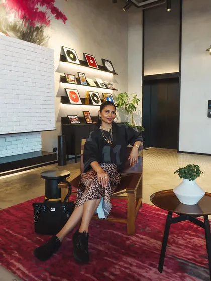 A wider shot of the room, showing how the decor and my outfit came together for a cohesive, stylish look.