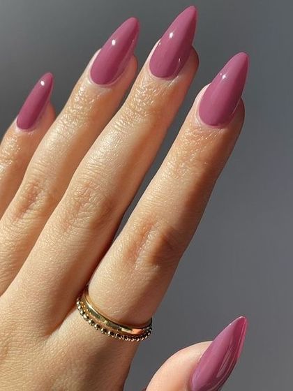 A beautiful mauve-pink shade on long almond nails. A perfect, versatile color.