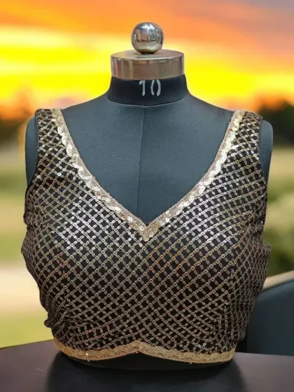 This ready-to-wear blouse features a beautiful black and gold sequin pattern. I offer a huge variety of blouses in brocades, silks, cottons, and sequins to suit all occasions.