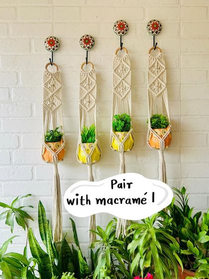 Our versatile mini ceramic planters look great paired with macrame. Here, they are styled with our natural white macrame plant hangers, creating a clean and modern boho look for your green corner.