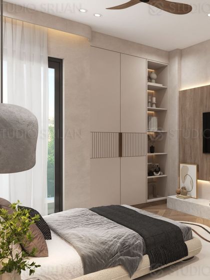 This view shows the wardrobe and storage solution, which includes open shelving for display, seamlessly integrated into the wall.