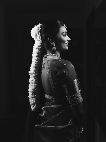 The same portrait in black and white, emphasizing the classic beauty and form of the look.