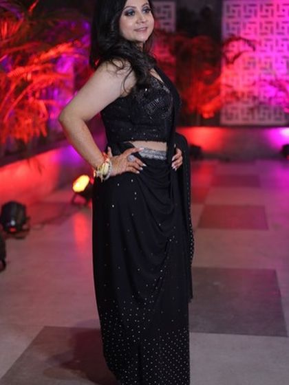 Posing with confidence. The complete look, from the makeup to the hair and outfit, came together perfectly for her cocktail night.