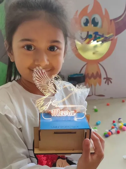Every child leaves with more than just a memory. They take home a creation they built themselves, like this personalized light-up lamp. It serves as a proud reminder of their accomplishment and a unique souvenir from your event.