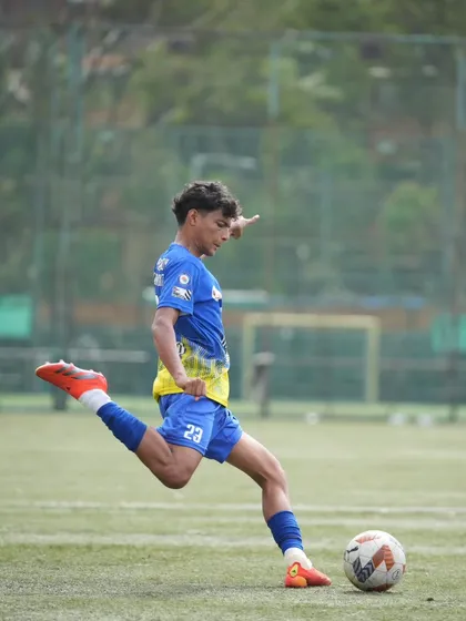 Executing a powerful shot on goal, a culmination of practice and in-game instinct.