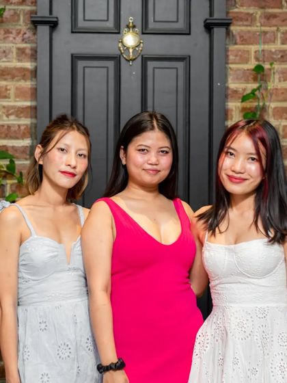 A trio of ladies looking elegant and ready for a fun night.
