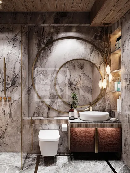 This elegant bathroom combines textured marble walls with statement double-ring mirrors and warm, woven-front cabinetry. The design feels both opulent and earthy, creating a unique, spa-like atmosphere.