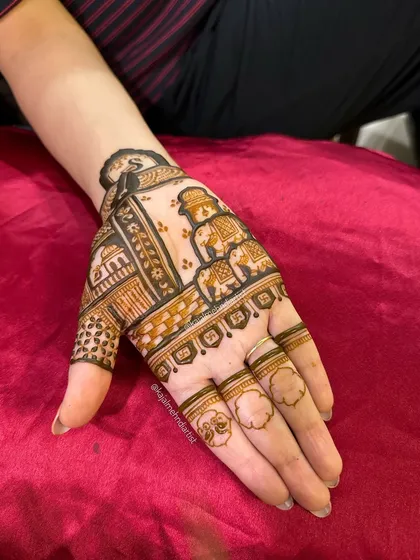 The completed elephant procession design on the palm.