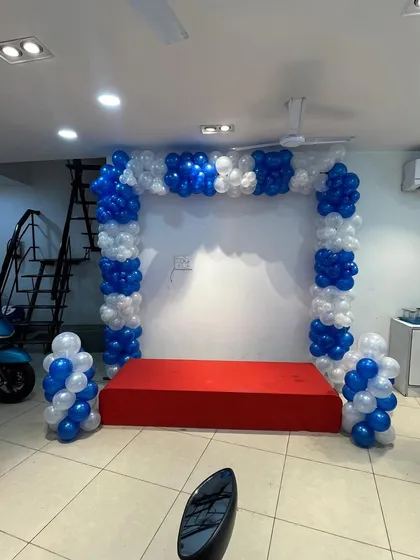 Another view of the showroom decoration, with a red carpeted stage.