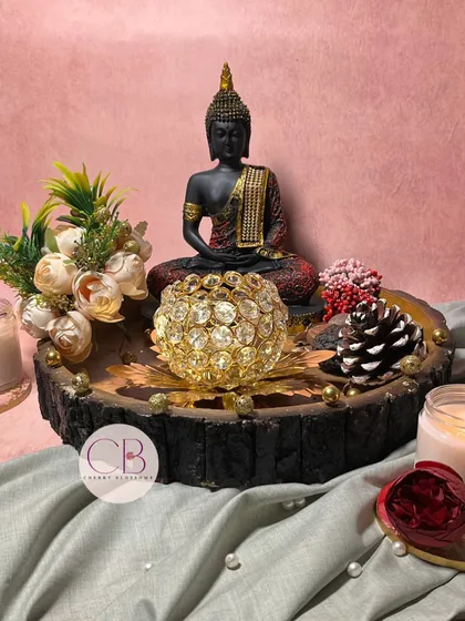 Embrace your loved ones with the luminous essence of Diwali with this priceless gift. A serene Buddha statue paired with a crystal T-light holder makes for a truly special present.