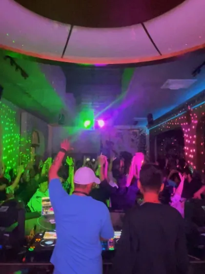Arms up, ready to take the crowd on a journey. This is the moment before the beat drops.