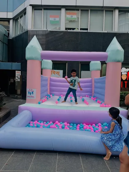 We love the soft, happy colors of our pastel bouncy castle. It comes with an attached ball pit filled with pink and blue balls, making it a beautiful and fun centerpiece for any celebration, indoors or outdoors.