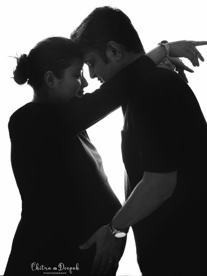 A tender black and white silhouette. This intimate embrace is captured beautifully, focusing on the emotion and connection without distraction.