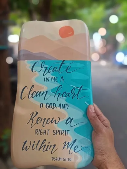 Art that inspires. This wooden art panel features a serene beach scene overlaid with a beautiful verse from Psalm 51, blending nature's beauty with words of spiritual renewal.