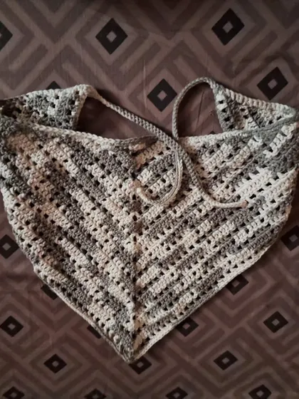 A flat-lay of the Retro Bandana Top, showcasing the classic chevron pattern and tie-back design.