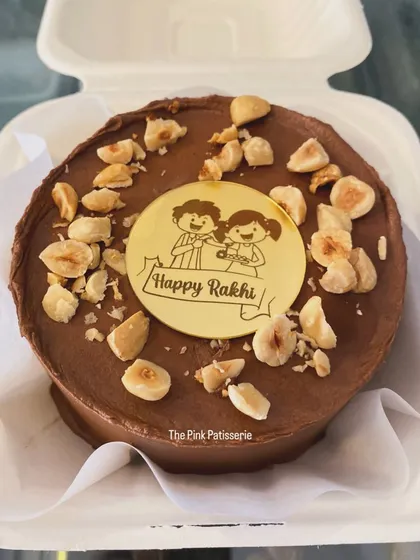 A special Raksha Bandhan bento cake. This chocolate hazelnut mini cake comes with a custom "Happy Rakhi" topper.