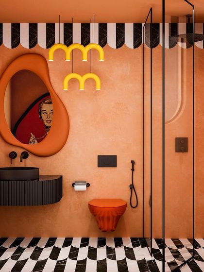 This bathroom is a playful mix of orange and black, with a quirky mirror reflecting a vintage-style artwork. The black and white graphic floor adds to the fun.