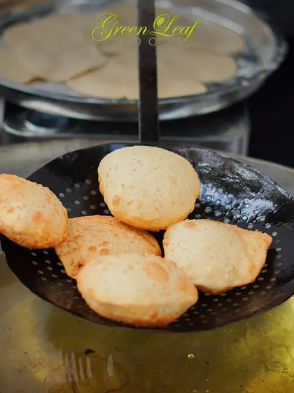 There's nothing like the simple pleasure of a hot, fluffy puri. We fry our puris fresh at events, ensuring they are perfectly puffed up and delicious, ready to be paired with our sabzis and curries.