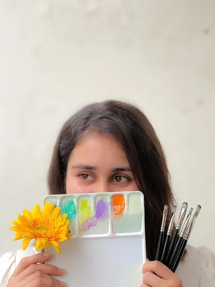 Peeking over my paint palette. Every color holds a possibility, a new emotion to be expressed on paper.