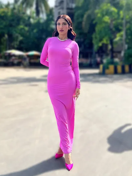 For a Tinder India event, I put Bhumi Pednekar in this vibrant pink bodycon dress from Skims. It's a simple, bold, and confident look that perfectly captures a modern, youthful vibe.