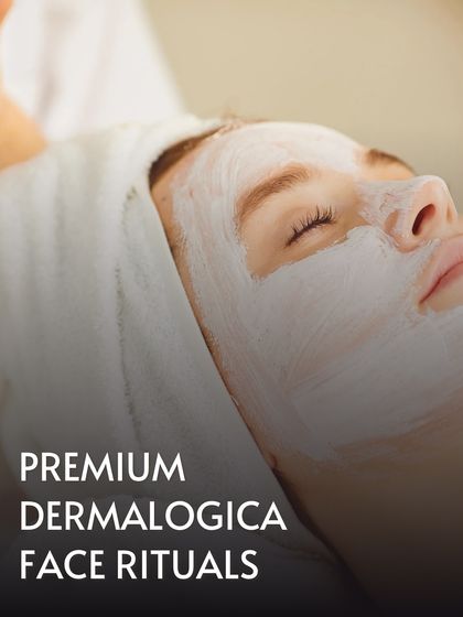 A close-up of a client enjoying a Premium Dermalogica Face Ritual. The thick, nourishing mask is applied to deliver potent ingredients directly to the skin, promoting a clear and calm complexion.