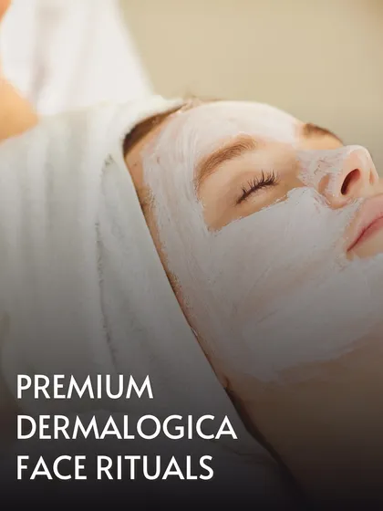 A close-up of a client enjoying a Premium Dermalogica Face Ritual. The thick, nourishing mask is applied to deliver potent ingredients directly to the skin, promoting a clear and calm complexion.