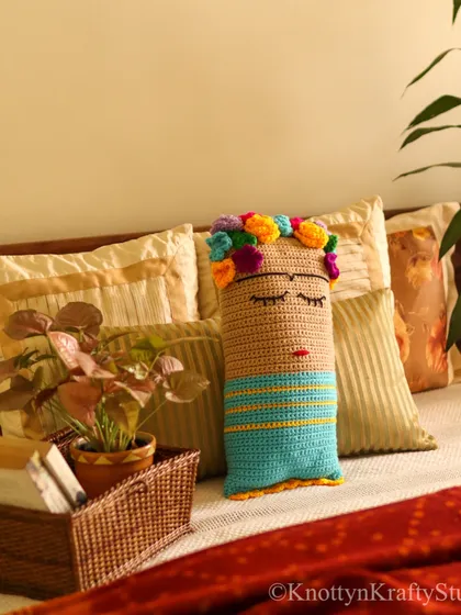 Inspired by one of my favorite artists, this Frida Kahlo crochet cushion is designed to add a bold and creative touch to any cozy corner. It features her iconic floral crown and a peaceful expression, perfect for a reading nook or bedroom.