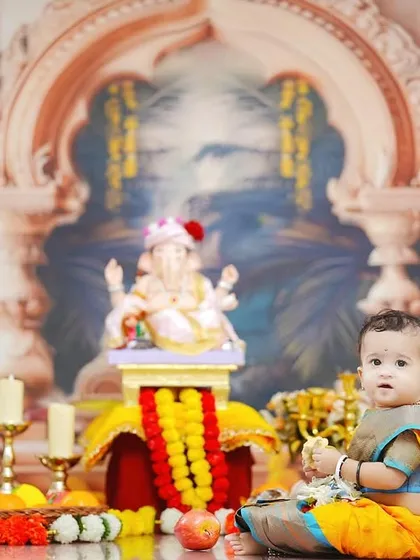 A wide shot of the entire Ganpati setup, showing the grand backdrop and all the festive elements that make these sessions so special.