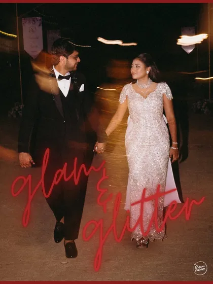 A motion-blur shot capturing the couple walking hand-in-hand, with the words "Glam & Glitter" perfectly describing the vibe of their cocktail night.