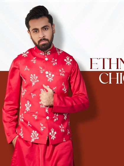 Unveil the regal look. This bright red kurta with a matching embroidered jacket is crafted for the modern gentleman who loves to make a statement.