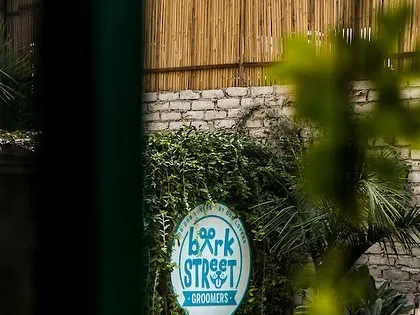 A peek at our grooming salon sign. We offer a full range of services to keep your pup looking and feeling their best.