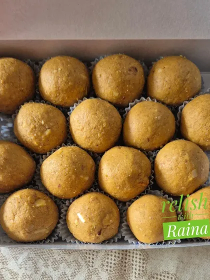 A smaller box of Besan Laddoos, showing the consistent size and shape I maintain for a professional finish.