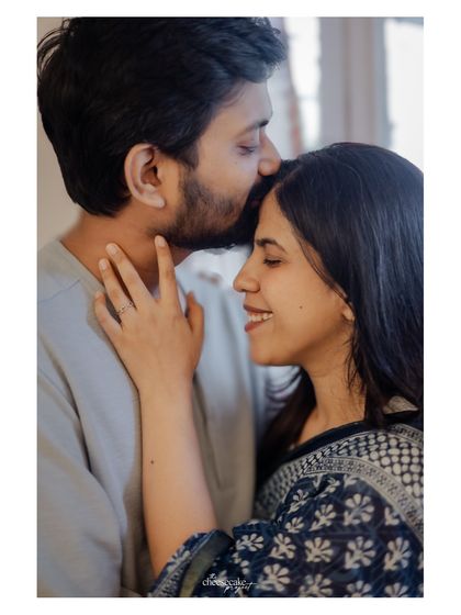 A gentle forehead kiss, a simple and powerful expression of love.