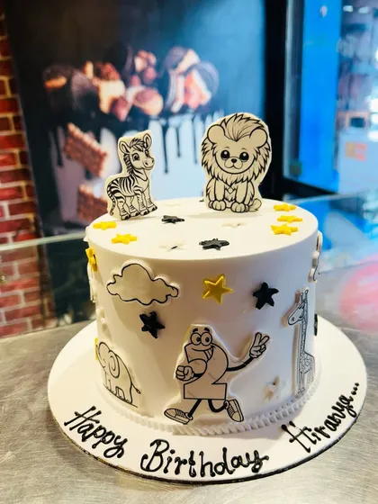 A unique black and white animal-themed cake, perfect for a creative and artistic birthday party.