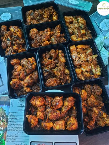 An international order of spicy chicken stir-fry and pork with bamboo shoots, packed and ready to fly to Dubai.