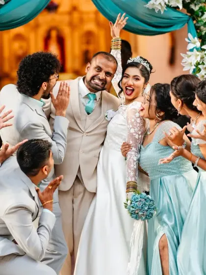 The bride and groom surrounded by their ecstatic bridal party. This photo is pure fun and captures the amazing bond they share with their friends.