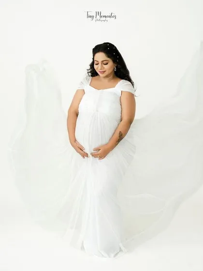 Angelic and pure, this portrait uses a white flowing gown to create a sense of delicate movement and timeless elegance.