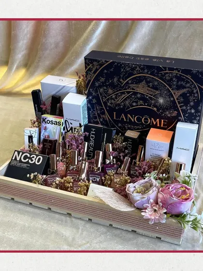 For the makeup lover in your life. This tray is packed with premium beauty products from brands like Lancôme, MAC, and Huda Beauty, creating a luxurious and impressive gift for any occasion.