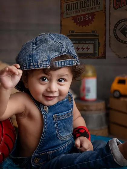 Meet the cutest little mechanic in town! I love creating these fun, imaginative toddler photoshoots. This little guy, with his denim overalls and cheeky smile, is ready to fix any car that comes his way.
